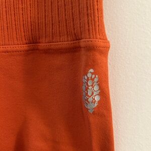 Free people, movement red earth Orange Leggings medium/large size